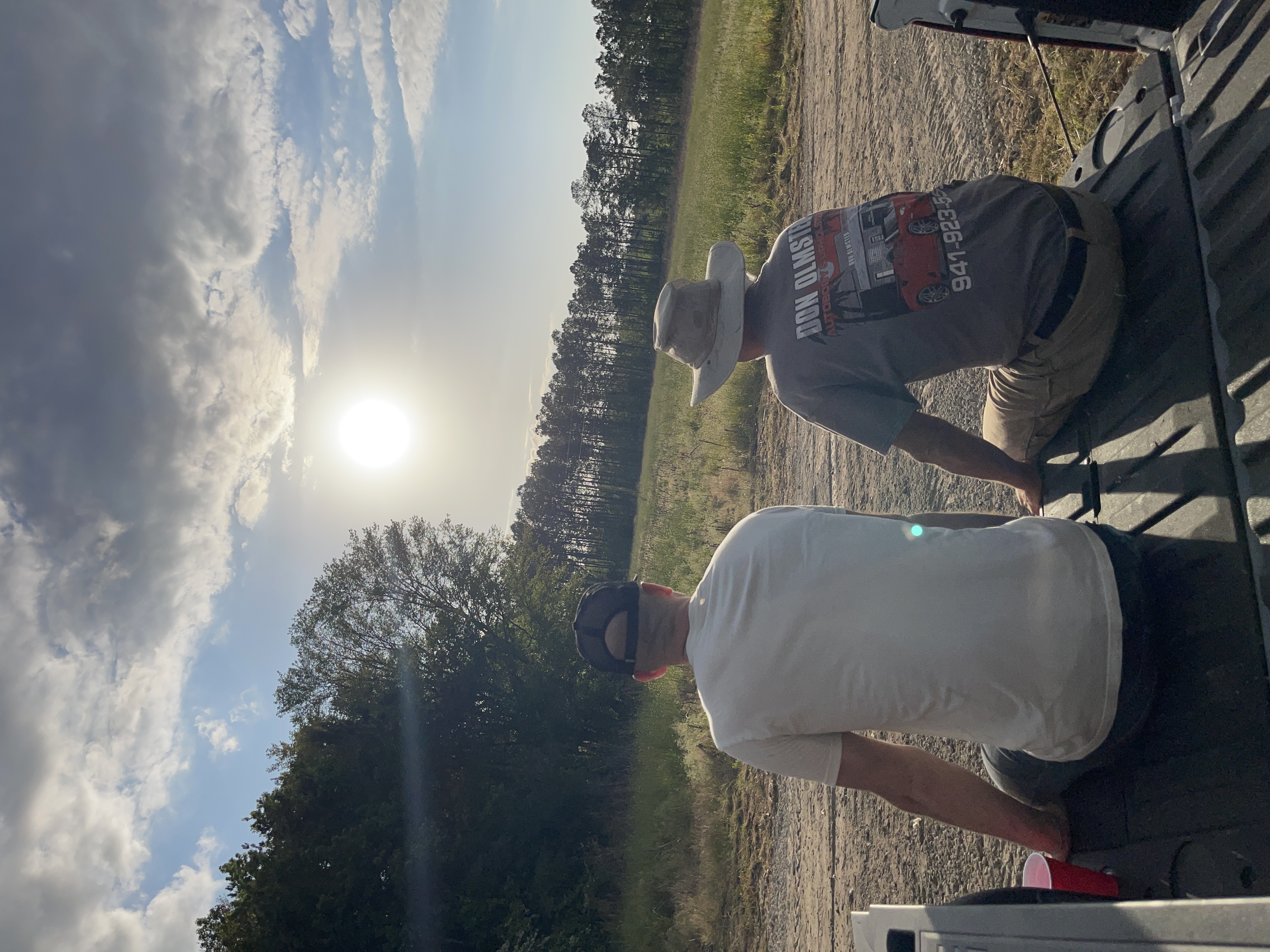 Kyle on the tailgate at Orenda Pastures